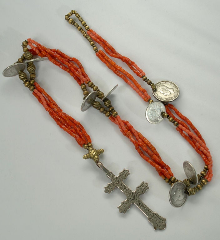 A fine and rare early 20th century 'chachal' rosary / necklace with wonderful old Ecuadorian silver coins, coral beads and a beautiful silver cross.<br />
<br />
Dimensions: hangs 26.5 inches. Silver cross measures 3.25 inches long.