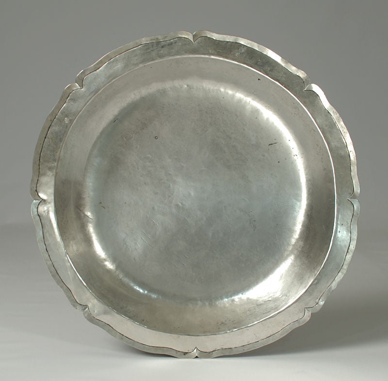 A large and impressive early 19th century Spanish colonial silver charger of circular form with scalloped edge. Heavy with high silver content.<br />
<br />
Dimensions: 15.75 inches. 890 grams.