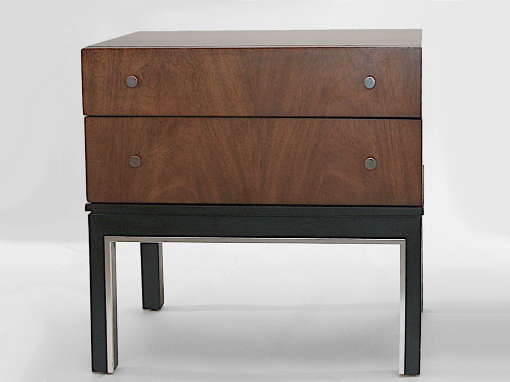 Stylish pair of night tables, marked Van Leigh, as shown Dark case, and legs with silver trim, walnut veneer drawer fronts with chrome pulls.  Priced as a pair $950.00