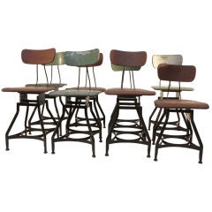 8 Adjustable Early Industrial Stools in nice old surface