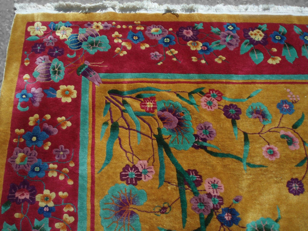 A Nichols Chinese Art Deco hand tied rug with marigold mustard field . Excellent bright vivid colors . No sun fading . Minor 