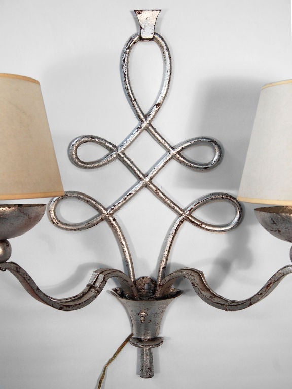 A single hand wrought iron sconce,<br />
circa 1930. Silvered. Appears to originally have been gilded.