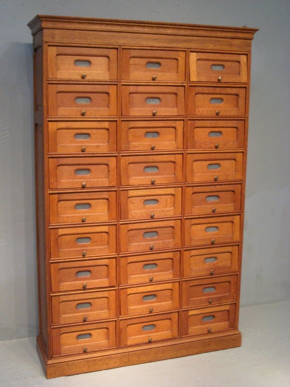 This unusual file cabinet has 27 drawers (measuring on the inside 11