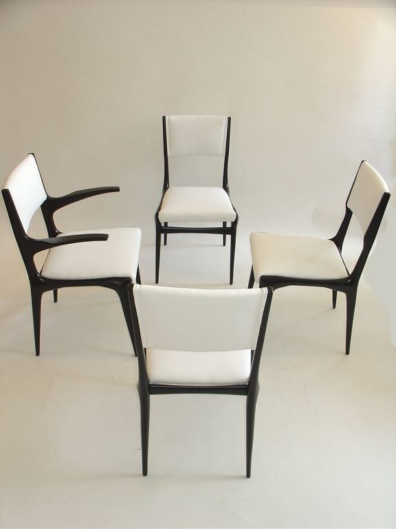 A set of Three Side Chairs and One Arm Chair by Gio Ponti.
