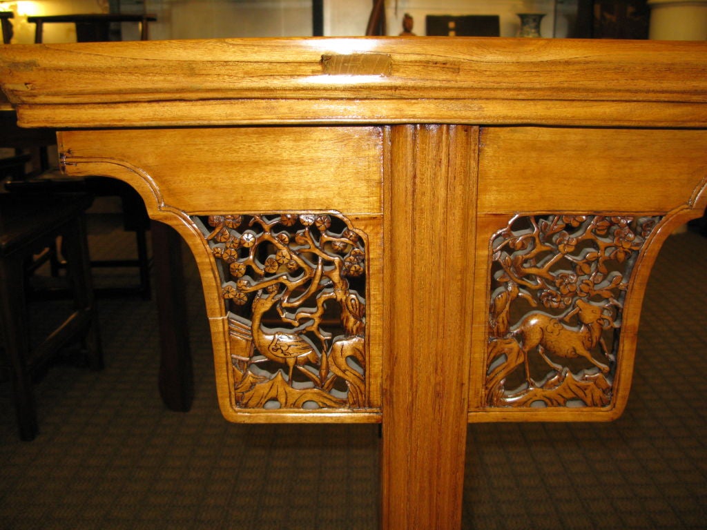A beautiful, light colored Poplar wood (Yangmu) altar table with unusually intricate carved spandrels and end panels.  Spandrels with small animals (deer and birds).<br />
<br />
On back of table, spandrels are plain, uncarved.