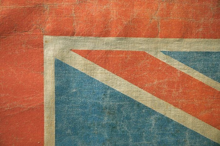 British Union Jack parade flag, printed on coarse cotton, made circa 1890-1920. The coloration, size, and proportions of the flag are great, and it has a wonderful, Ralph Lauren, well-worn but well-loved feel.