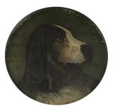 LATE 19TH CENTURY PAINTING OF A DOG ON A WOODEN CHARGER: