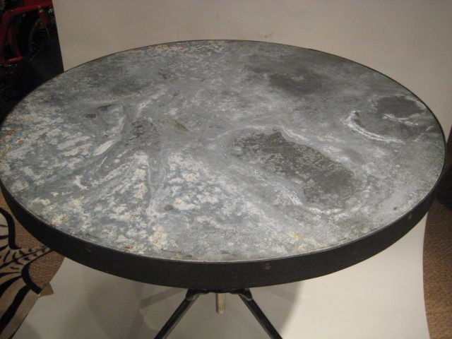 Interesting oxidized zinc top tripod table