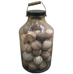 A very Large Jar with Vintage Baseballs and Softballs