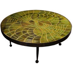 A Round Cocktail Table in Tile and Steel