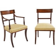 Set of sixteen Regency mahogany dining chairs.