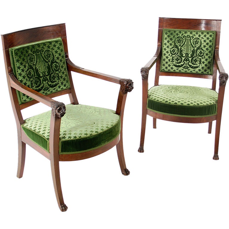 Pair of French Empire mahogany elbow chairs. For Sale