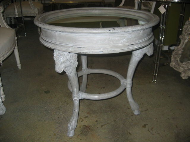 Beautifully painted in a grey, distressed finish. Ram's head details and hoof feet. Mirrored top in excellent condition.