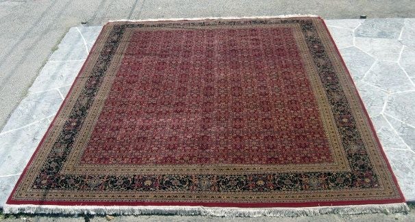Beautiful all wool carpet manufactured in India by the Arthur T. Gregorian Oriental rug company. Red, blue, and gold natural dyed carpet. The centered area of the carpet is a multiple floral pattern. The outlining border is detailed with flowers and