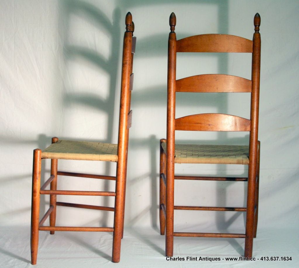 From the Mount Lebanon New York South Family. The chairs were designed and made by Brother William Perkins between 1900 and 1920.<br />
<br />
The chairs have ladder backs with original seats.<br />
<br />
This will make a great addition to any