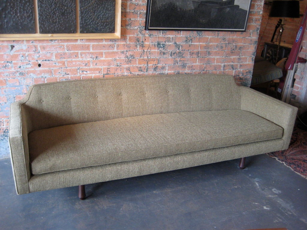 A sofa with mahogany legs designed by Edward Wormley for Dunbar. Reduced from $5800.