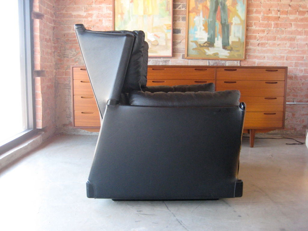A rare and extremely comfortable pair of large black leather Viola d'Amore Armchairs (#104) designed by Piero de Martini for Cassina. These chairs were purchased directly from Italy by the original owner.