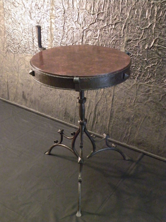 Rare Medieval Wrought Iron Round Table / Stand with Porphyry top, ca. 1500, featuring a massive round porphyry top. The porphyry probably imperial Roman, made from a section of a column.
21” diameter, 30.5” high
Ex. Collections:
Hoentschel, J. P.