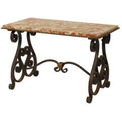 Baroque style iron and marble  top coffee table