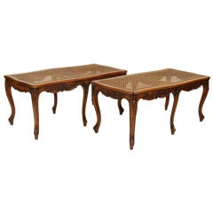a matched pair of Louis XV provincial carved walnut benches