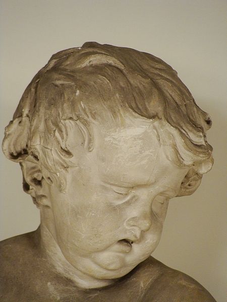 composistion bust of a cupid