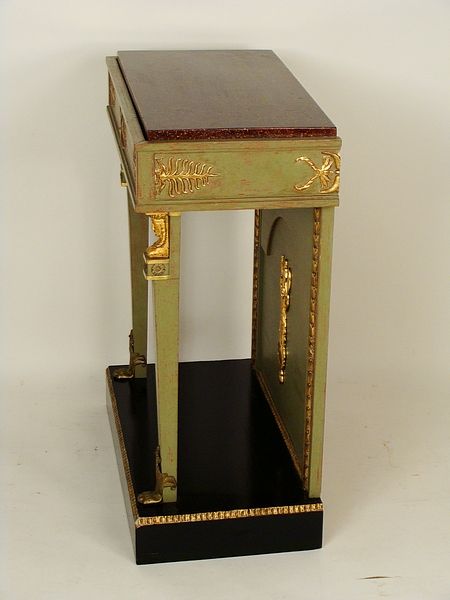 Empire style green painted console table with ormolu trim and<br />
a faux marble top, circa 1950.