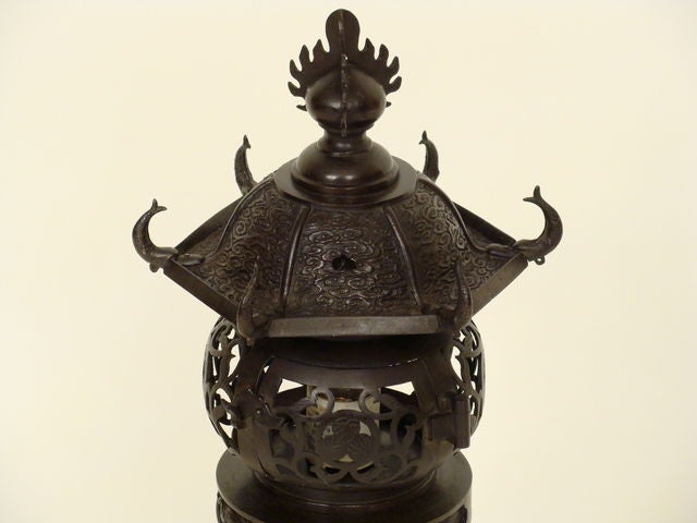 Chinese bronze lanterns converted into lamps. Exceptional detail with dolphins at the top, turtles, and dragon wrapped around the base.
