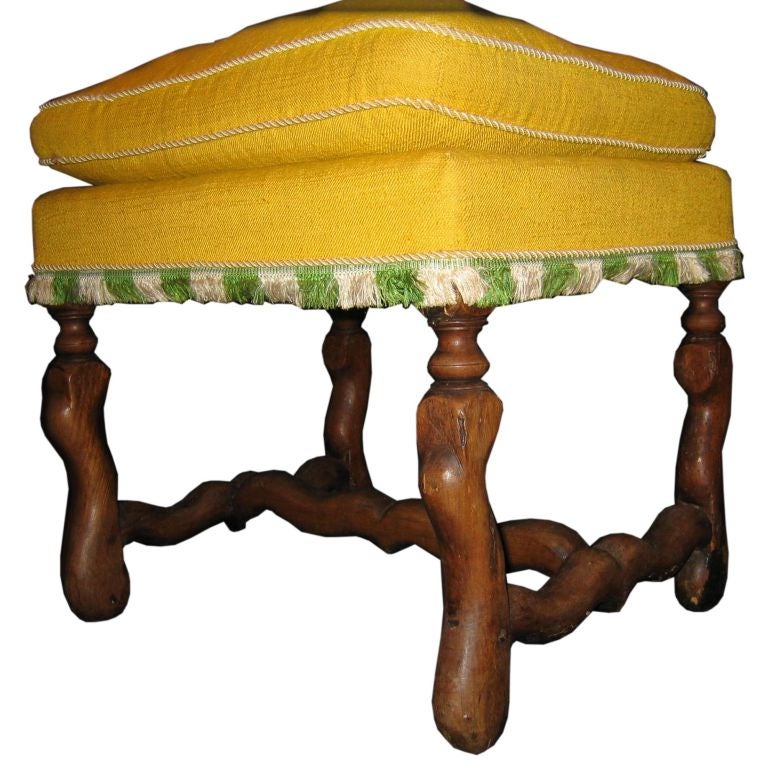 A walnut stool with ‘Os de mouton’ legs and stretcher For Sale