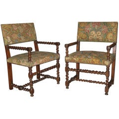 A pair of Henri IV walnut arm chairs