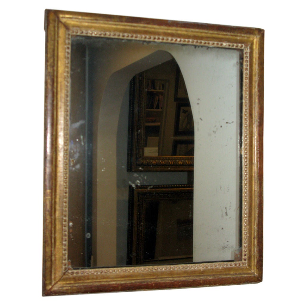 A gilded wood Louis XVI  mirror