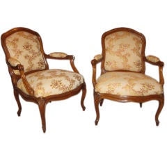 A pair of walnut armchairs
