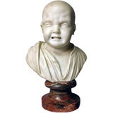 Carved marble bust of a crying baby