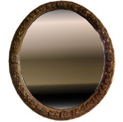 Antique Louis XIV carved and giltwood oval mirror