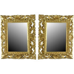 Pair of small carved and giltwood mirrors