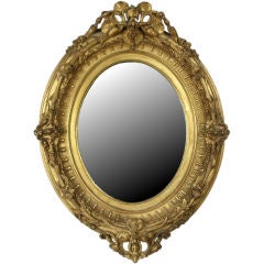 A delightful Louis Philippe carved and giltwood mirror