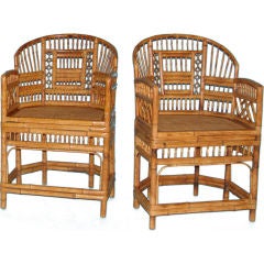 A pair of Brighton Pavillion style bamboo armchairs