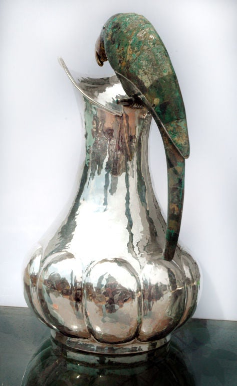 PLEASE VISIT LAUREN STANLEY IN NEW YORK CITY<br />
<br />
A fine silver plate water pitcher by Los Castillo, of Taxco, Mexico, the base bulbous with ten (10) loves, with a handle of malachite-like stone in the shape of a parrot.    <br />
<br