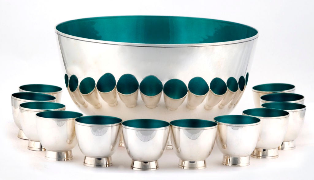 PLEASE VISIT LAUREN STANLEY IN NEW YORK

A rare circa 1955 sterling silver enameled punchbowl and twelve (12) cups by Towle, of Newburyport, MA, body sterling silver and interior a stunning green 'enamel'.  The interiors are not actually an