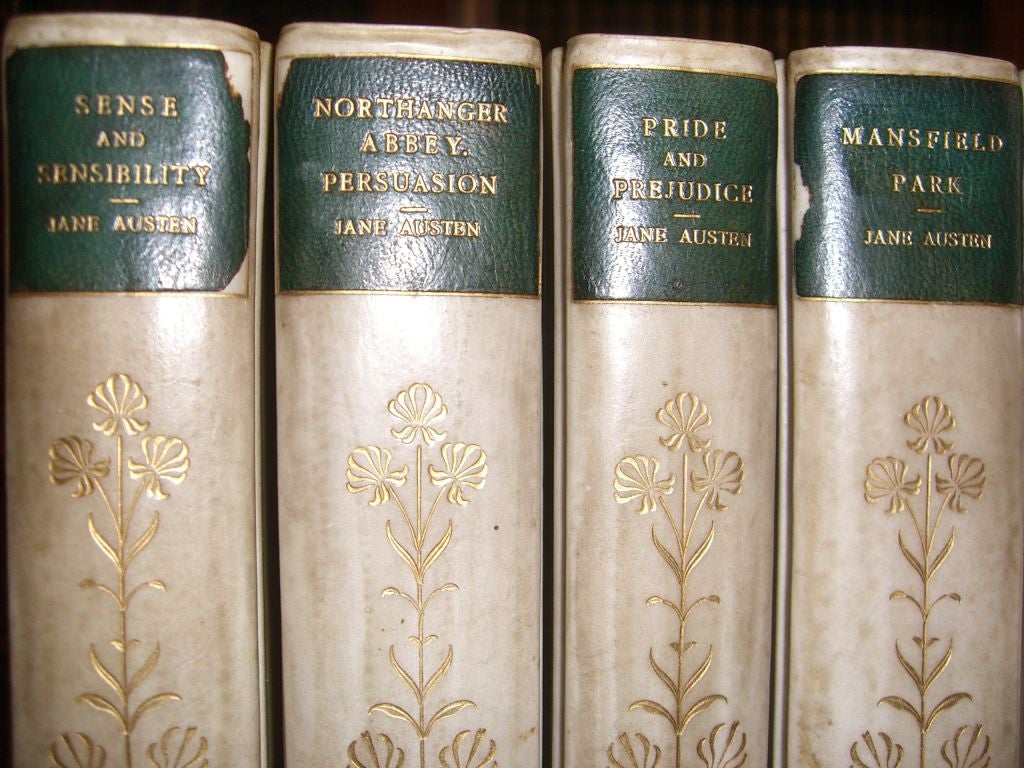 Five volumes Jane Austen novels bound in three quarter vellum<br />
and blue cloth boards, spine gilt with floral design and gilt title<br />
labels, top edge gilt, marbled endpapers, illustrated frontispiece. Published  MacMillan and Company,