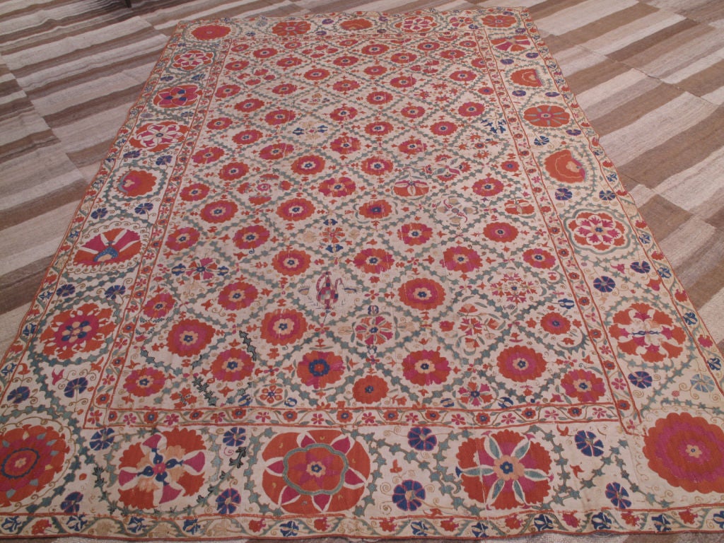 Antique, collectible Suzani from Uzbekistan. Pieces like this Suzani are associated with wedding customs and are among the most impressive examples of textile art.