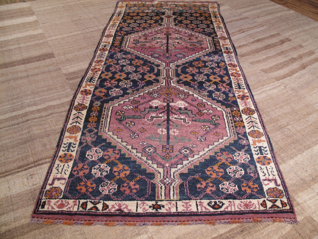 Charming tribal rug from the high mountains separating Turkey and Iran. Unbelievably soft and glossy wool, unusual color palette.
