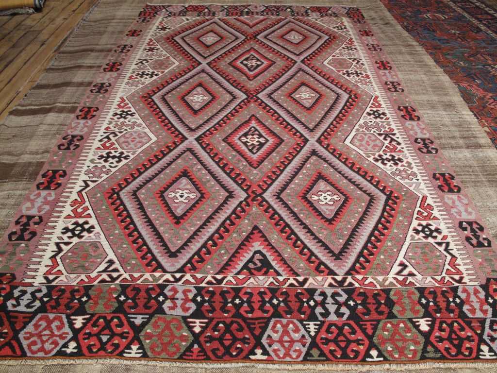 Fethiye Kilim rug. Lovely Turkish kilim rug with an unusual color palette and great tribal design.