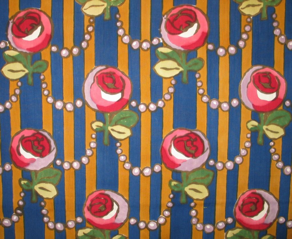 English c. 1920's roller printed cotton with a blue and gold wide striped ground with a repeated design of roses with stems connected by pearl strands.
