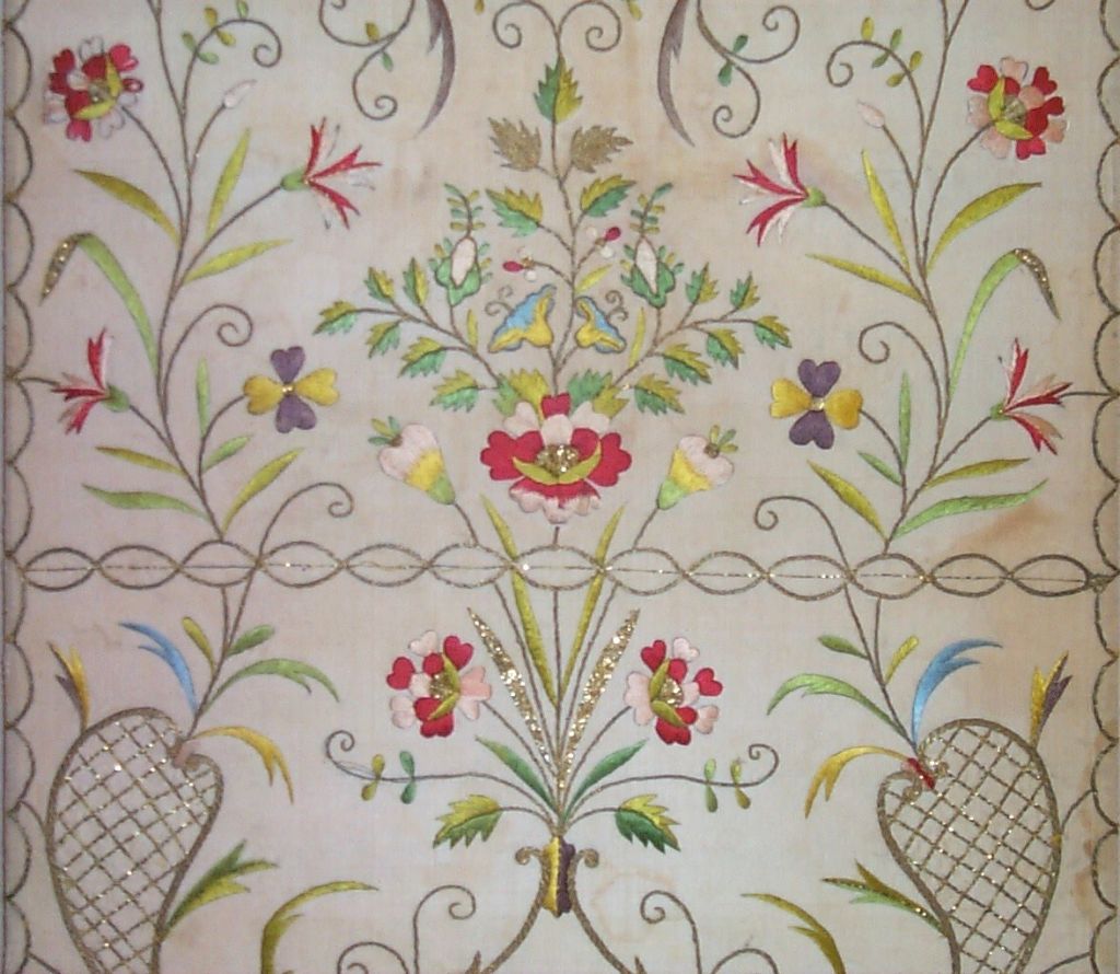 18th century (1780) French silk embroidery on cream colored silk ground in a stylized floral pattern with metallic embroidery.
