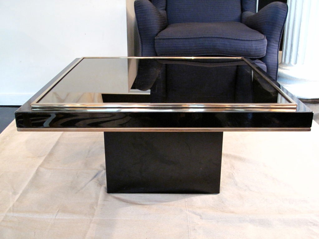 Black lacquer square side table with 23k gold trim and inset amber mirrored glass top. Two tables available.