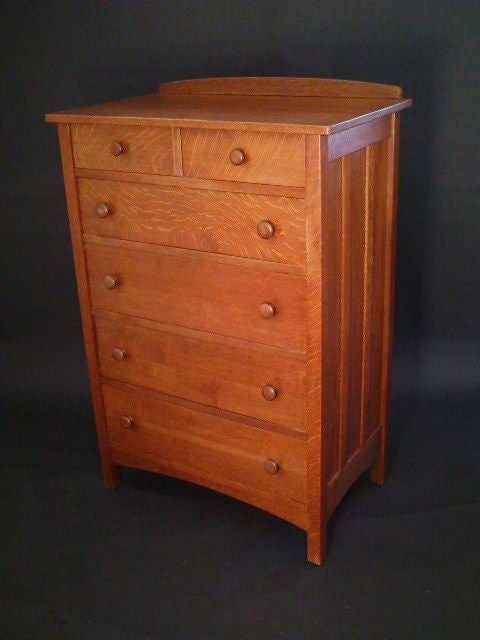 American Arts & Crafts tall chest having two half drawers over Four full size drawers.Paneled sides and subtly arched front and side rails, give this chest a delicate but sturdy look.Top gallery back board shaped at same angle as bottom arched rail.