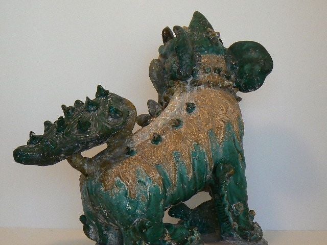 Wonderfully expressive foo dog, female with paw on pup, very detailed with applied flowers, bushy tail, big ears and fur.