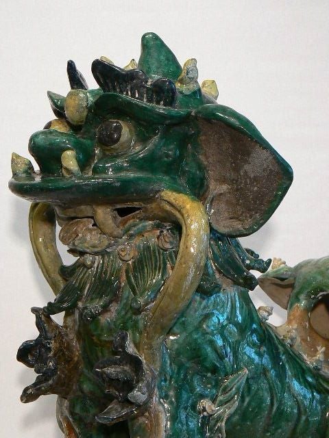 Wonderfully expressive large foo lion, green glazed body with applied decoration in black and yellow