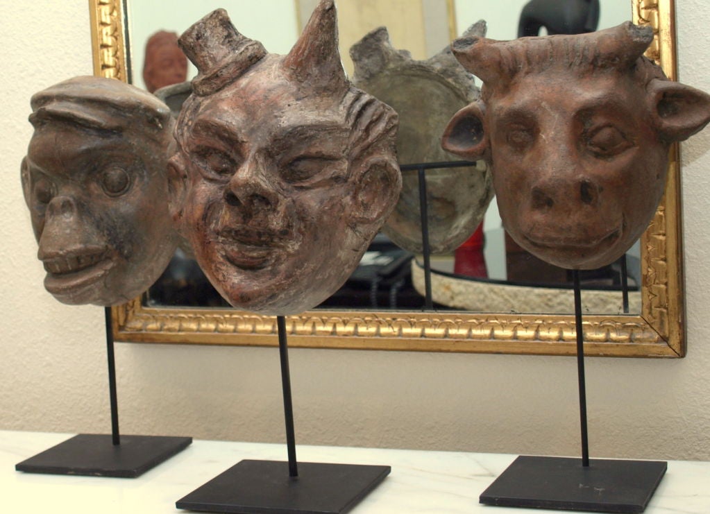 These masks mounted on stands are actually earthenware molds that were used to make paper-Mache masks.  They reflect the Mexicans’ obsession with celebration and transformations and connect both children and adults with ritual; Skeletons and the