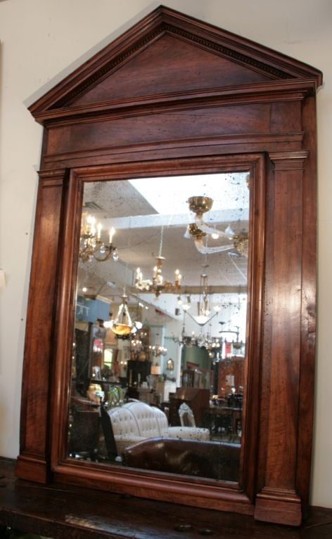 Spectacular antique French Directoire period solid hand carved walnut boiserie mirror.